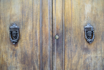 Details of an ancient Italian door in Florence, Italy.