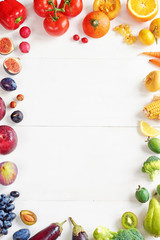 Rainbow colored fruits and vegetables on a white table. Juice and smoothie ingredients. Healthy eating / diet concept.