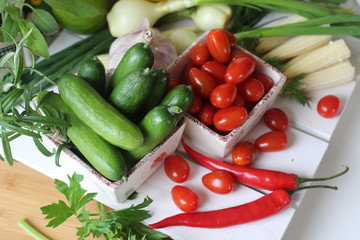 fresh vegetables and herbs, oregano, sage, chive, parsley, dill, onion, cucumber, green vegetables,  red vegetables, red pepper, pepper, garlic, cucumber, sweet corn, 