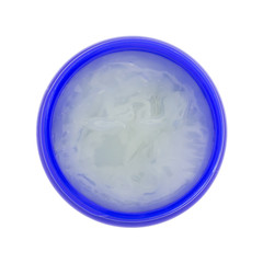 Top view of an opened container of chest rub isolated on a white background.