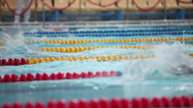 Swimming freestyle womans low angle view  close to