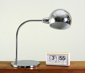 Stylish chrome table lamp with spherical shade