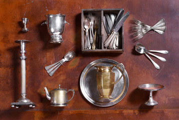 Assorted silver kitchenware arranged on wood