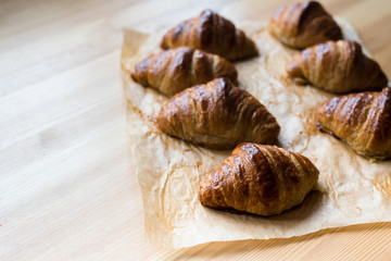 Homemade whole wheat croissants on baking paper