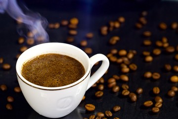 Obraz na płótnie Canvas Cup of coffee on black background