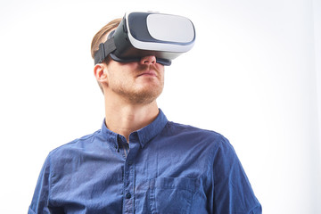 Man wearing virtual reality goggles. Studio shot, isolated background  headshot close up portrait