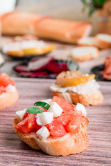 Bruschetta with creame cheese and beet on wooden background.