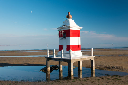 Typical buildings in Lignano Sabbiadoro. Terrazza Mare and lighthouse