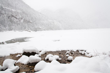 Snowfall on the frozen lake