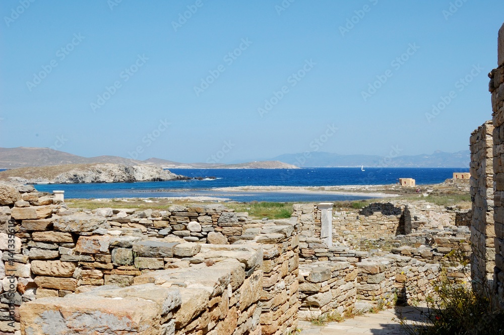 Wall mural Marble ruins/ island of Delos, one of largest museums of antiquity under open sky. ruins of 1-5 centuries BC, the UNESCO world Heritage site. Cycladic Archipelago, Greece, Aegean Sea 