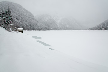Snowfall on the frozen lake