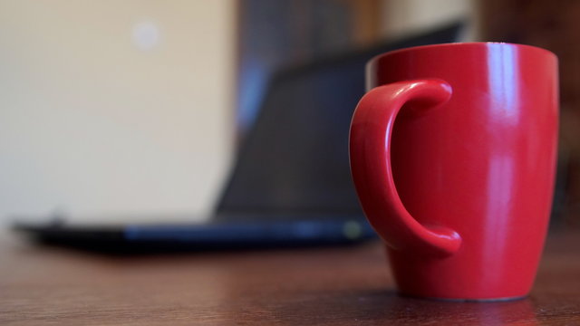 Coffee Cup And Laptop At Office