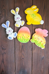 Decorated Easter Bunny and Egg Cookies on a wooden background. Easter concept.