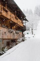 Walk in the village under a heavy snowfall