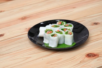 spring roll and vegetable  on banana leaf in plate, Select focus with shallow depth of field.