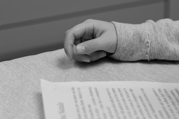 Hands studying. Black and white.