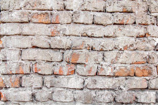 Red cement brick wall texture with mortar background close