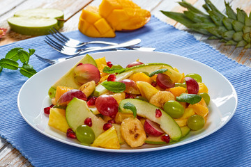 fruit salad on platter on table