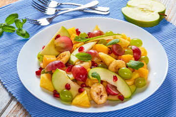 colorful fruit salad with mint leaves