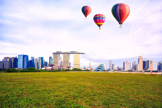 Colorful hot-air balloons flying over the park at singapore