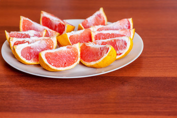 Naklejka na ściany i meble Two grapefruits slices