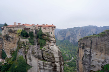 Fototapeta na wymiar Mountains of greece, fog and monastery