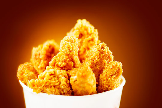 Fried Chicken wings and legs. Bucket full of crispy kentucky fried chicken