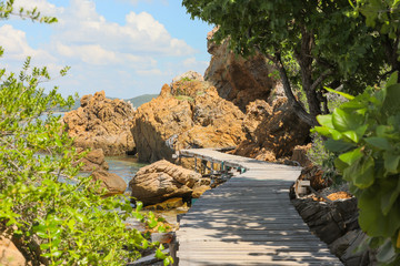 wooden trail along the shore of the island of love in Thailand