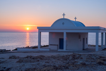 Small white church on the Cyprus during sunrise