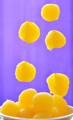 sweet golden egg yolk ball dropping on little cup
