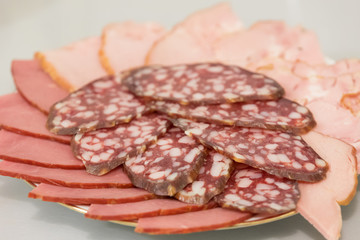 three kinds of sausage sliced