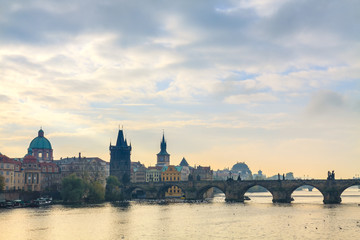 Morning view on Charles Bridge over Vltava river in Prague, Czech Republic.