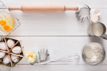 Baking ingredients on white rustic wood background, copy space