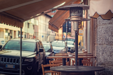 Gas heater, patio heater, mushroom heater. Tables for eating outdoors.