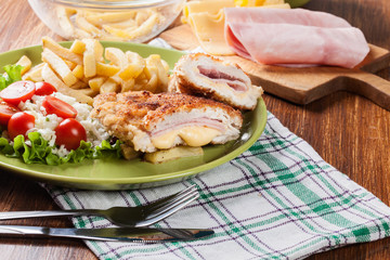 Cutlet Cordon Bleu with pork loin served with French fries and salad