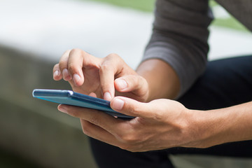 man hand holding, using smart phone or smartphone