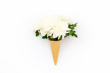 chrysanthemum flower in a waffle cone on a white background.
