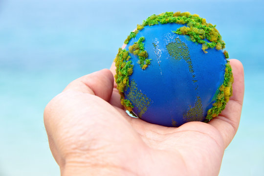 concept image of Earth in hand