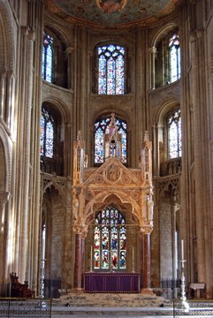 Stained glass windows and altar inside Peterborough Cathedral, UK.