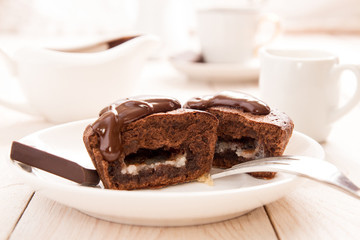 Chocolate french dessert cake mi-cuit on white plate