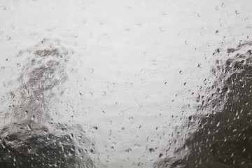 structural glass pane with rain drops