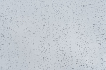 drops of water rain on window pane glass