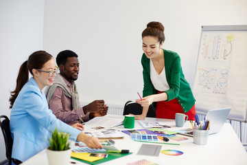 Business group analyzing new data on paper