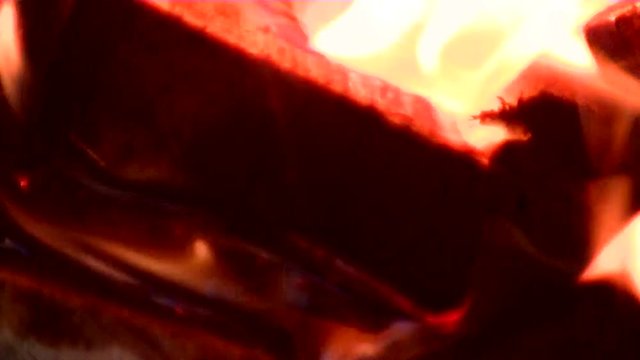 Firewood burns brightly. Beautiful bonfire in the dark