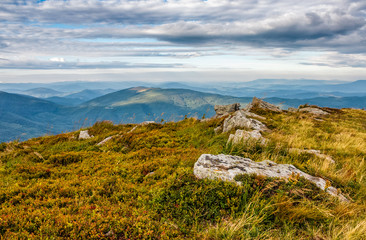 huge boulders on meadow on top of mountain ridge