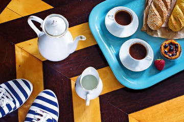 Portuguese breakfast. Room service in hotel in Portugal. Black coffee, pasteis de nata, strawberries.