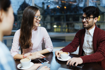 Happy companion gathered in cafe at leisure