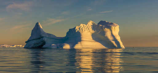 Huge icebergs of different forms in the Gulf. Their source is by the Jakobshavn glacier. This is a...