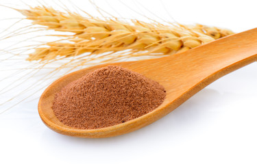 malt extract in wood spoon on white background