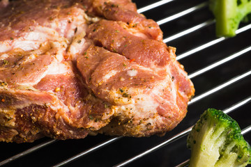 Raw meat with spices on the baking tray